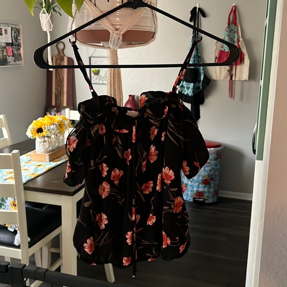 Side extra small, cute off the shoulder top with straps.